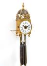 A miniature French brass lantern wall clock with striking and alarm, circa 1750.